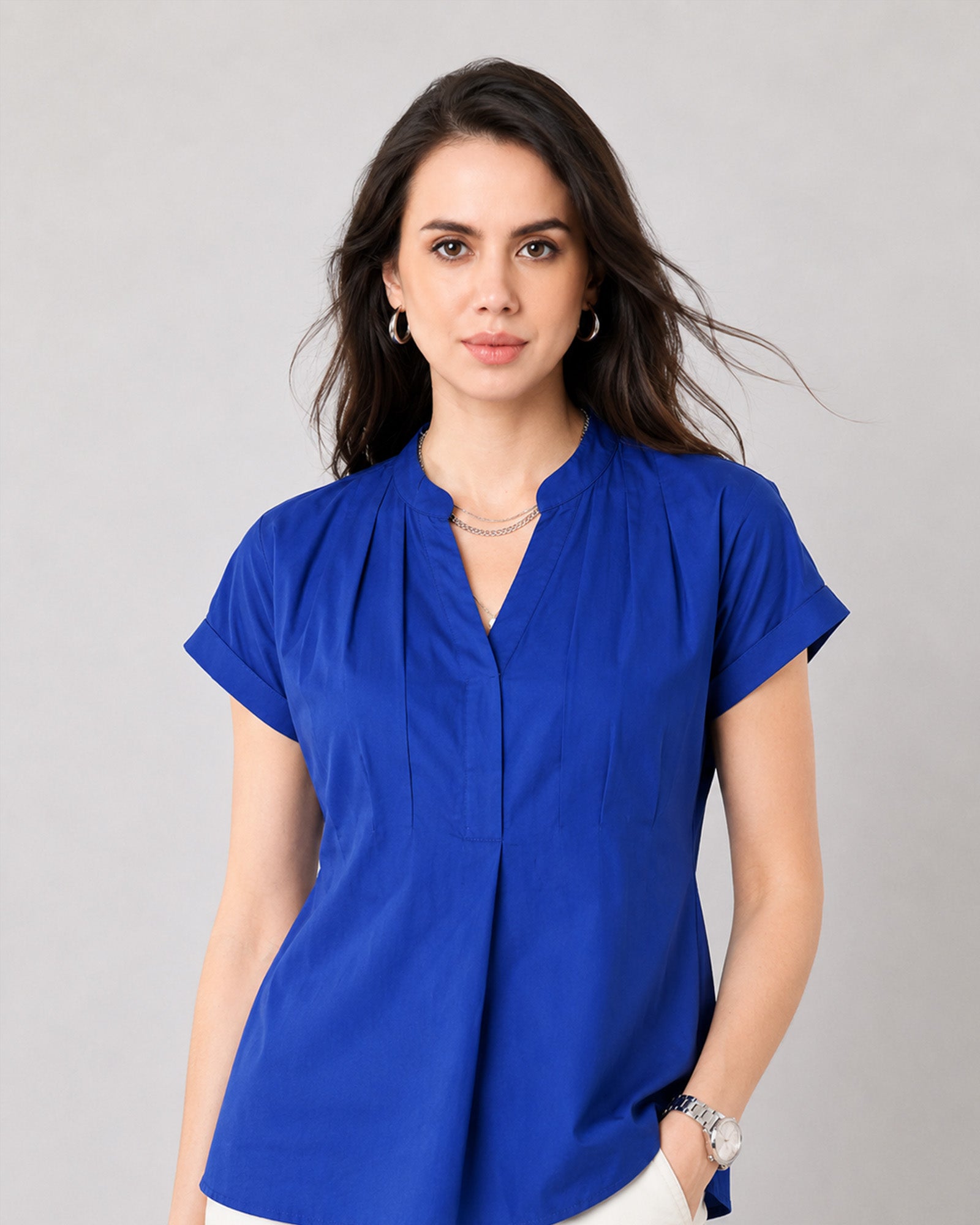 Close-up of Greta royal blue office top notched V-neckline and centre front inverted pleat