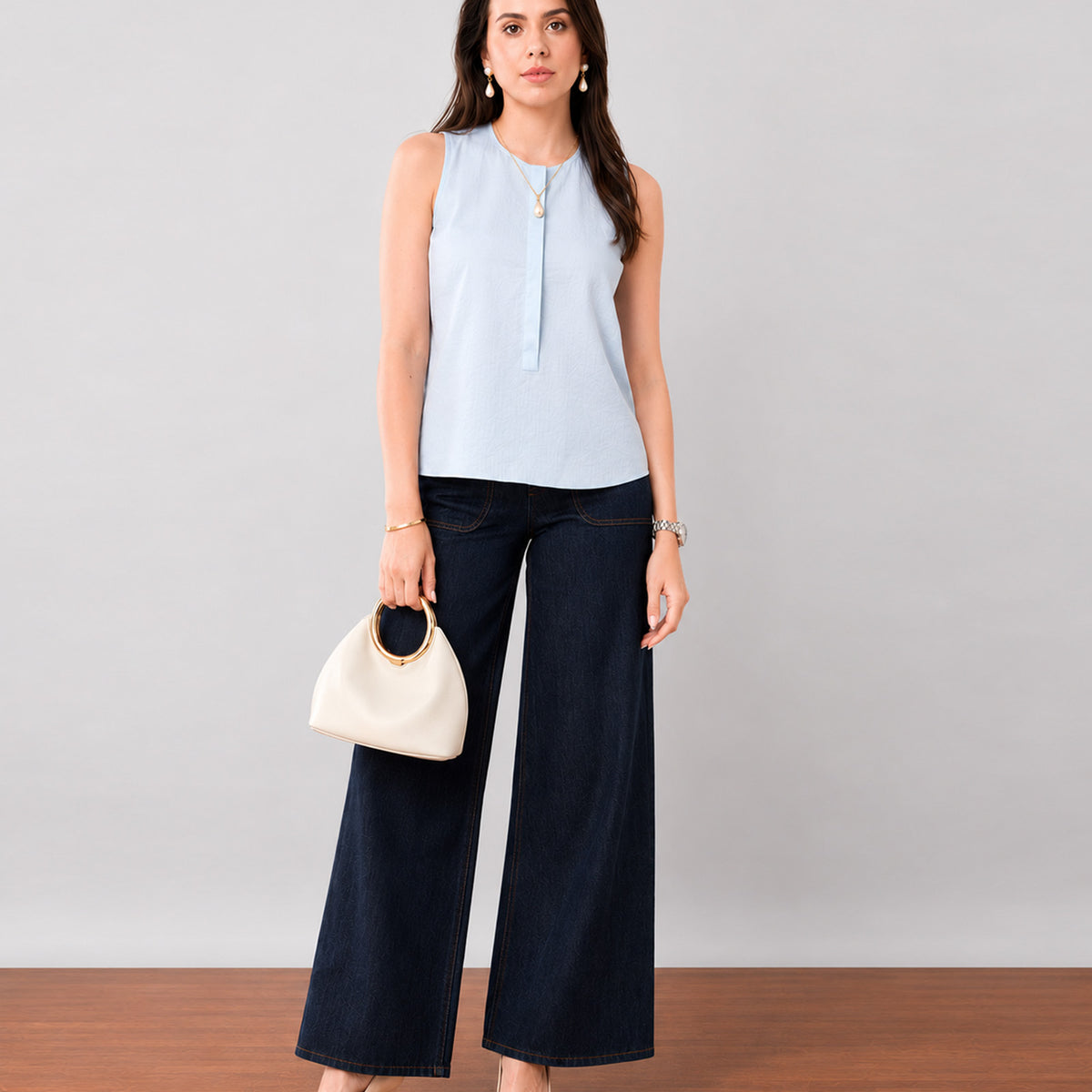 Gazillion Gusta minimalist sky blue sleeveless pin tucks top for women, full-length front view