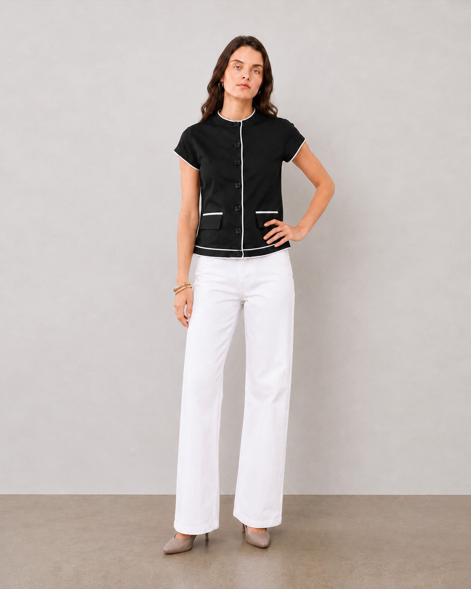 Harmony black and white stand collar cotton top, angled view with contrast piped hem