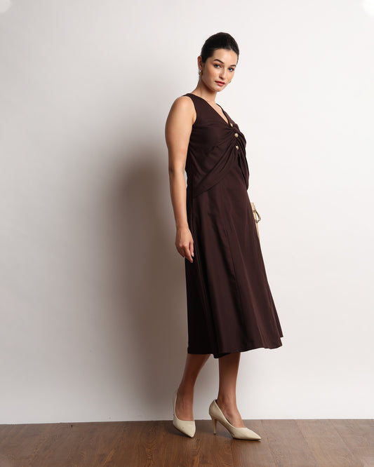 Hazel dark brown drapy dress with golden buttons, styled front view
