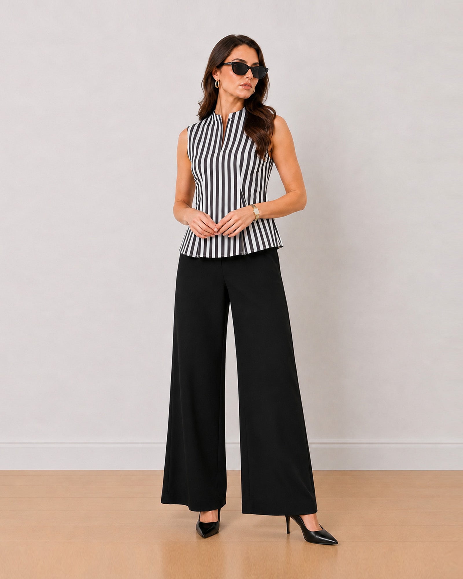 Hellen black and white striped cotton top showing inward pleats at princess seams