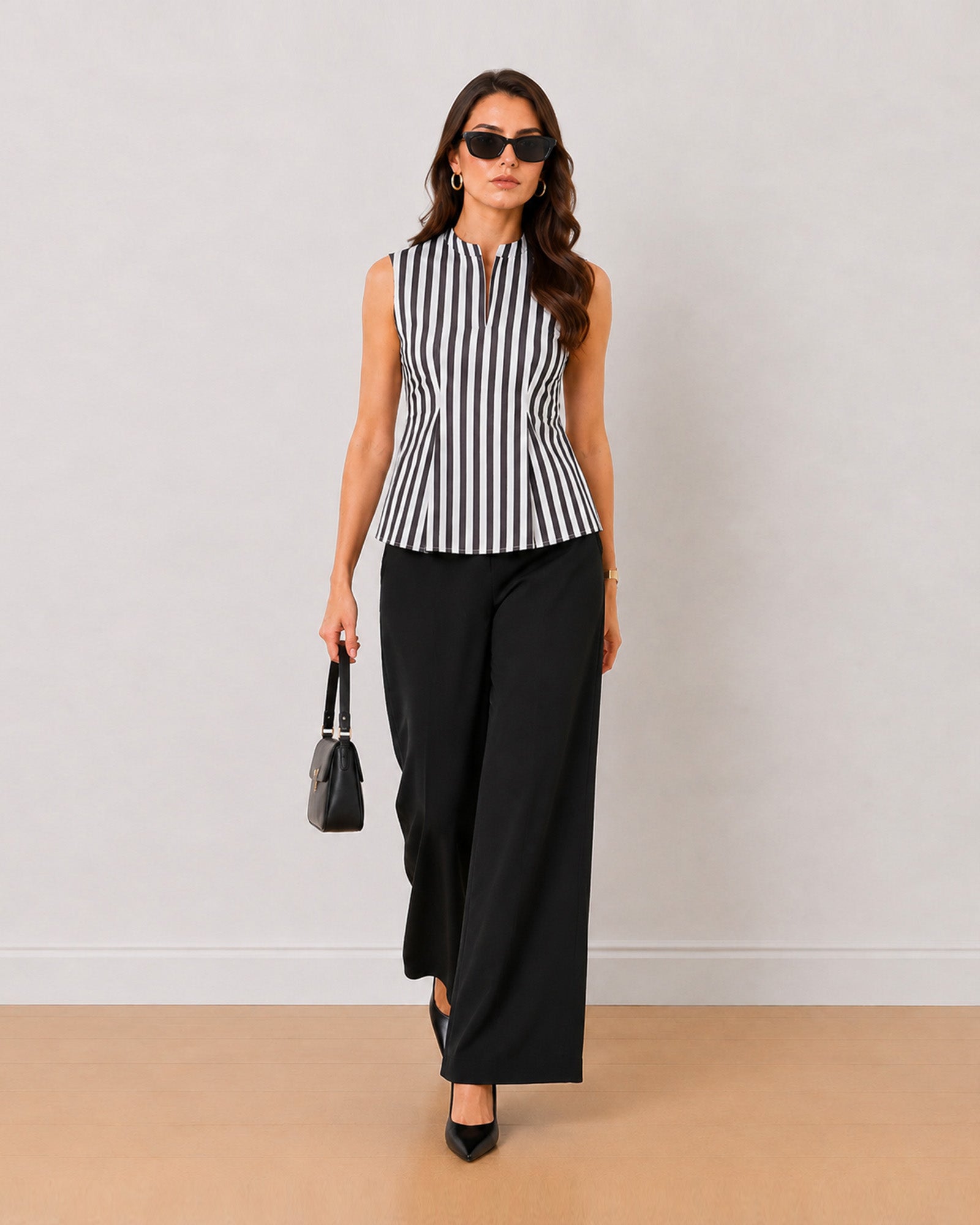 Hellen black and white striped formal top styled with black wide-leg trousers