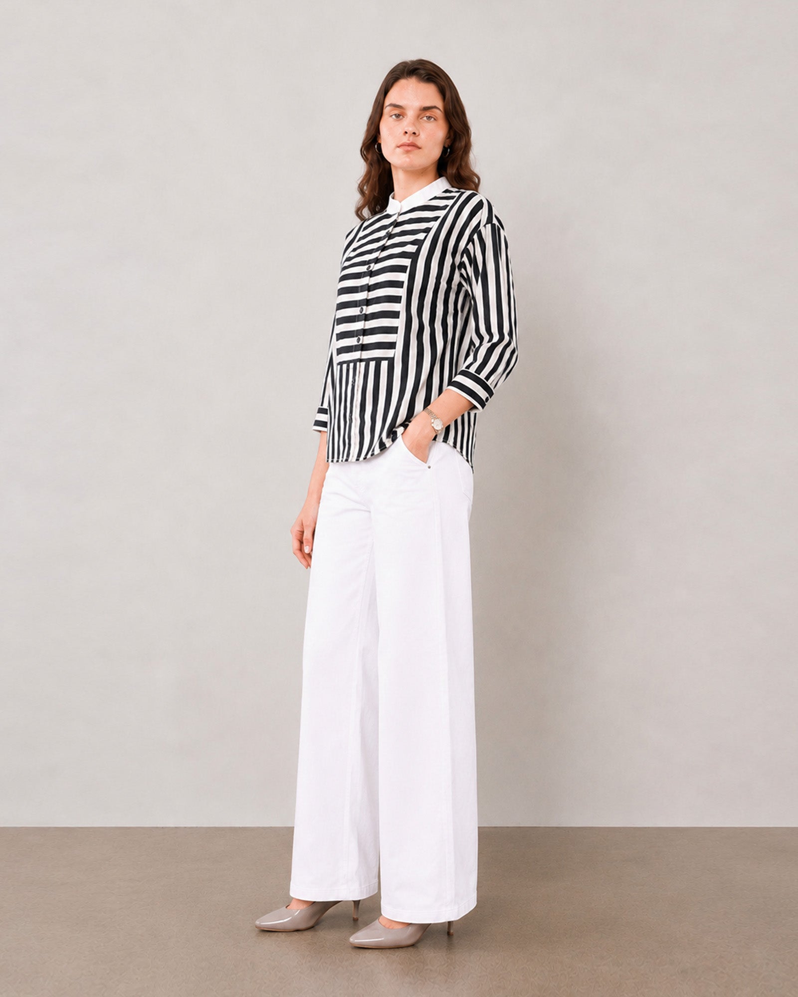 Helvia black and white striped shirt, angled view showing white contrast collar