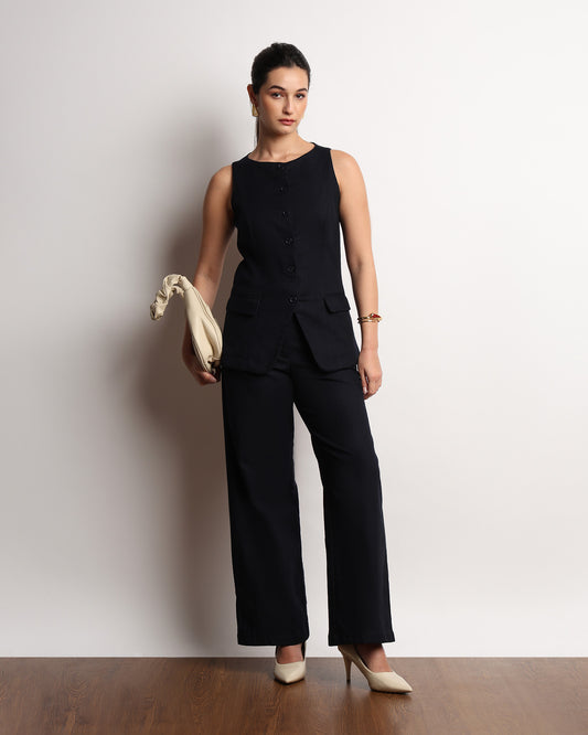 Henrid navy blazer top styled with a clutch, full-length front view
