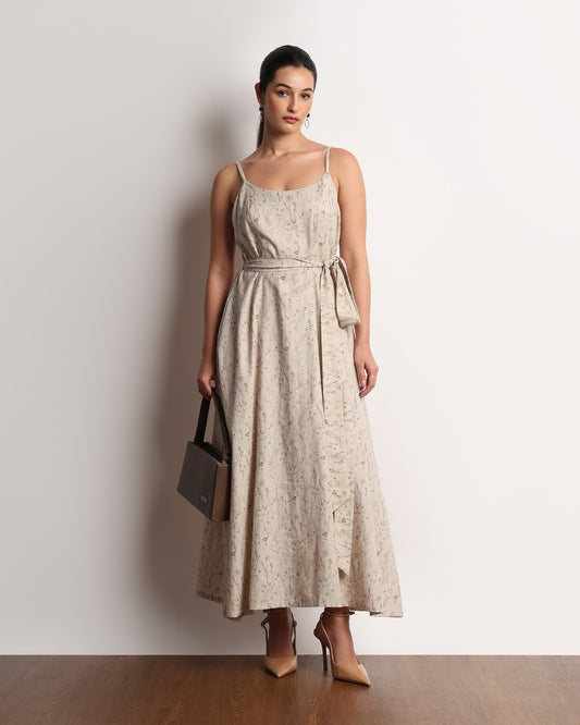 Hiva beige printed midi dress styled with a shoulder bag, full-length front view