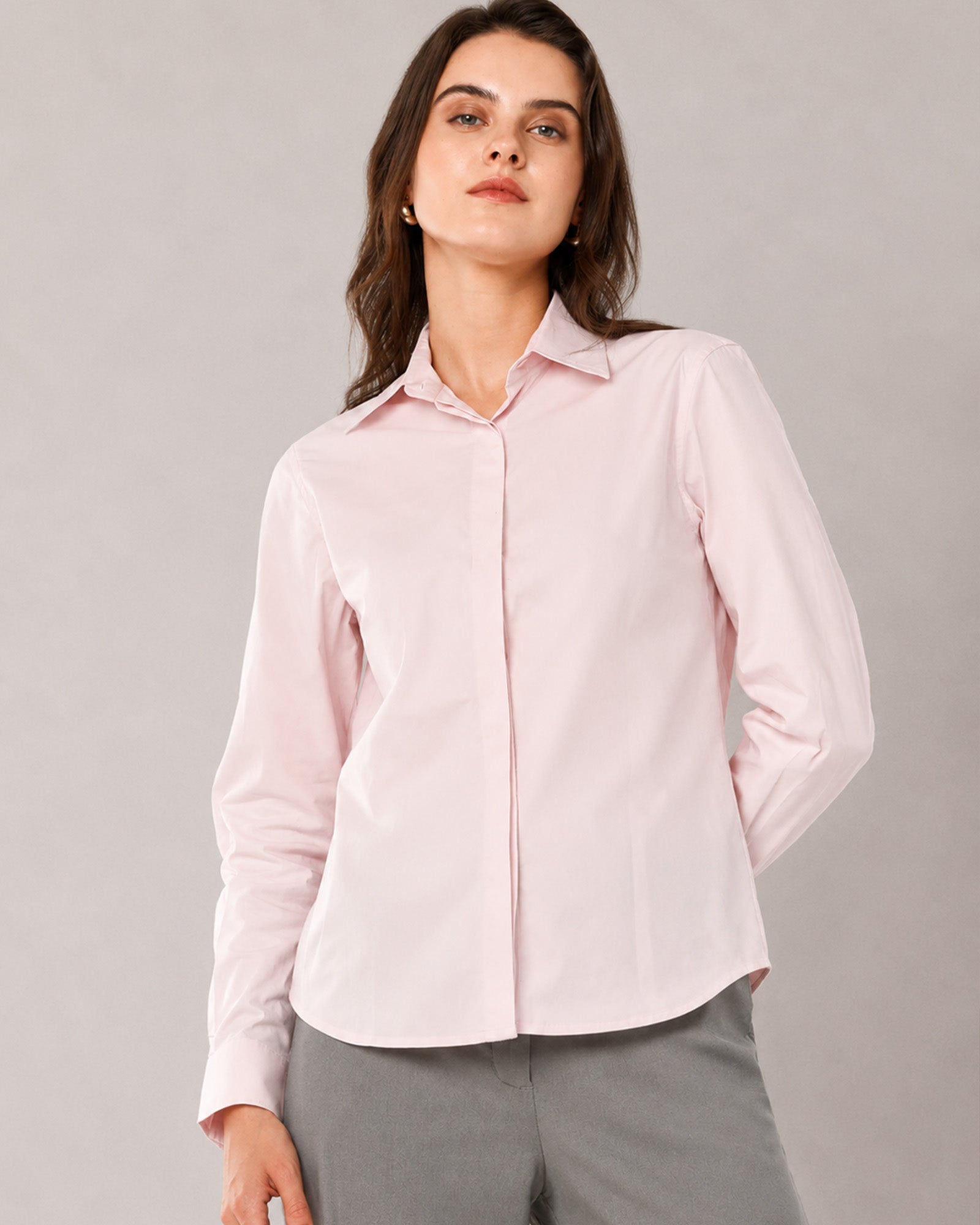 That baby pink cotton stretch shirt with a concealed front placket and hidden dignity buttons, close-up view