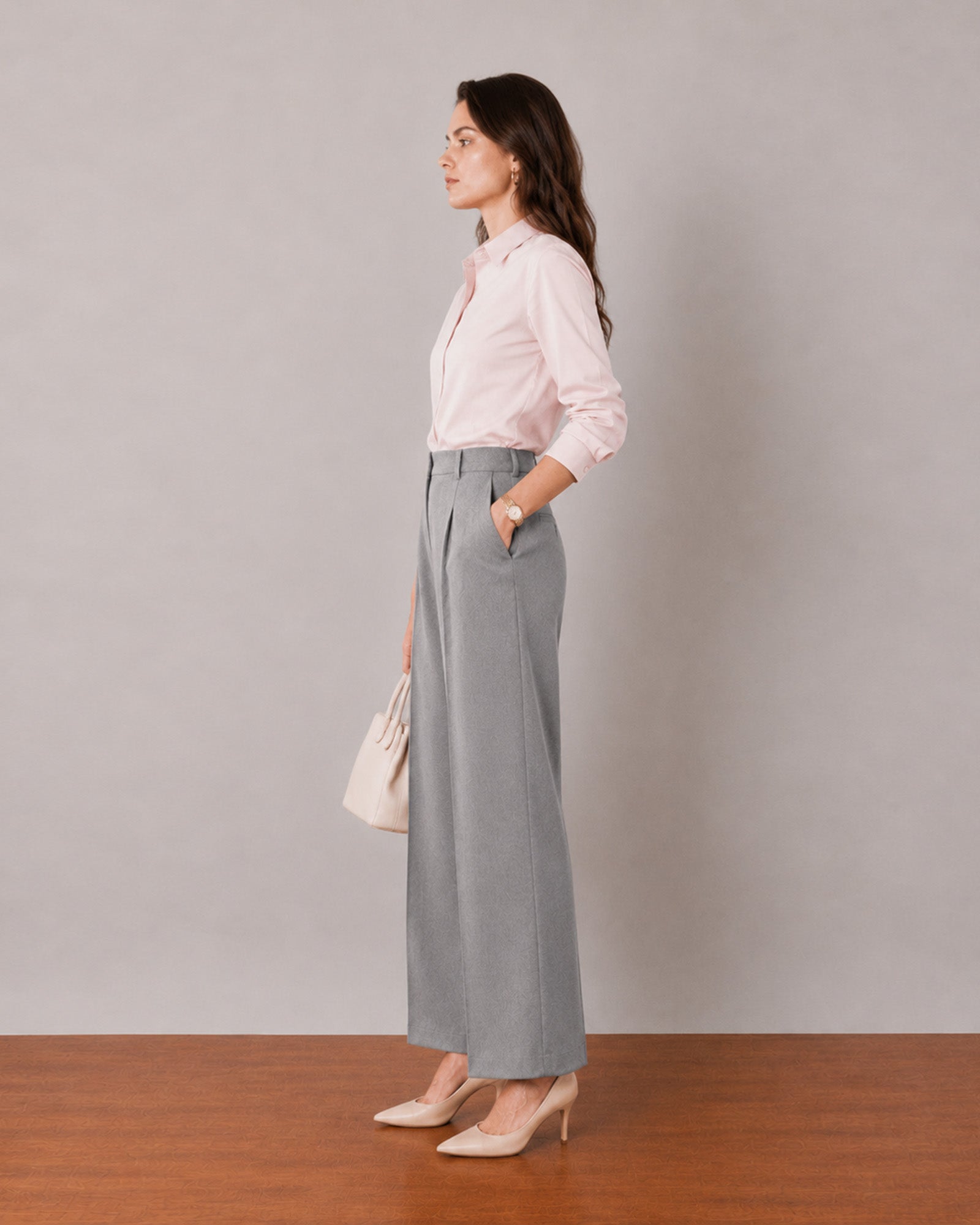 That baby pink formal shirt with tailored cuffs and side seam darts, side profile view
