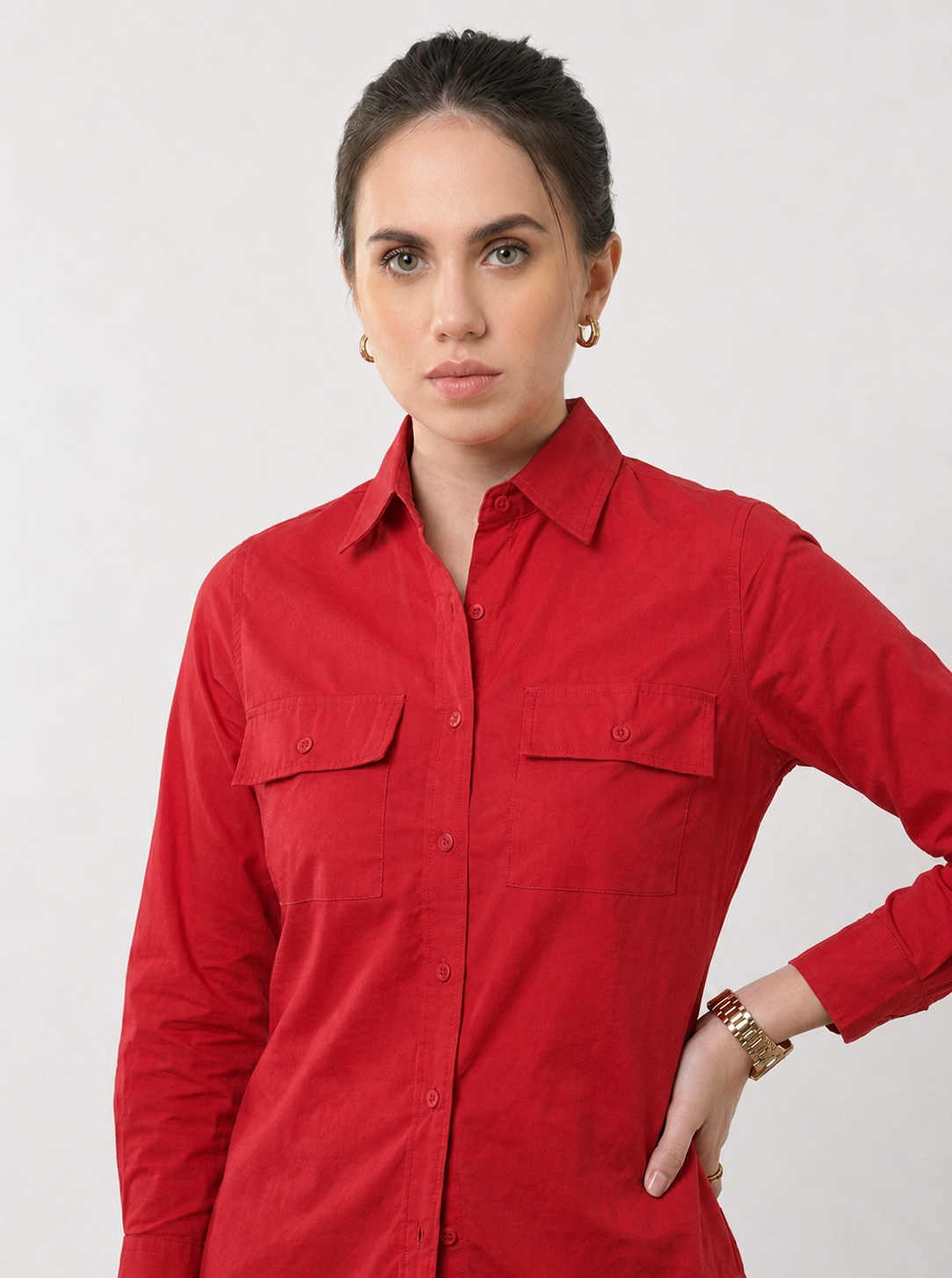 Close view of the flap pockets and button placket on the Gracy scarlet red utility shirt