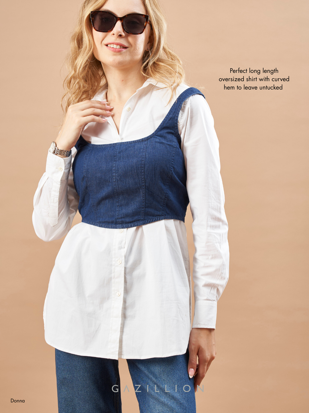 Woman wearing a white shirt with a blue vest against a beige background