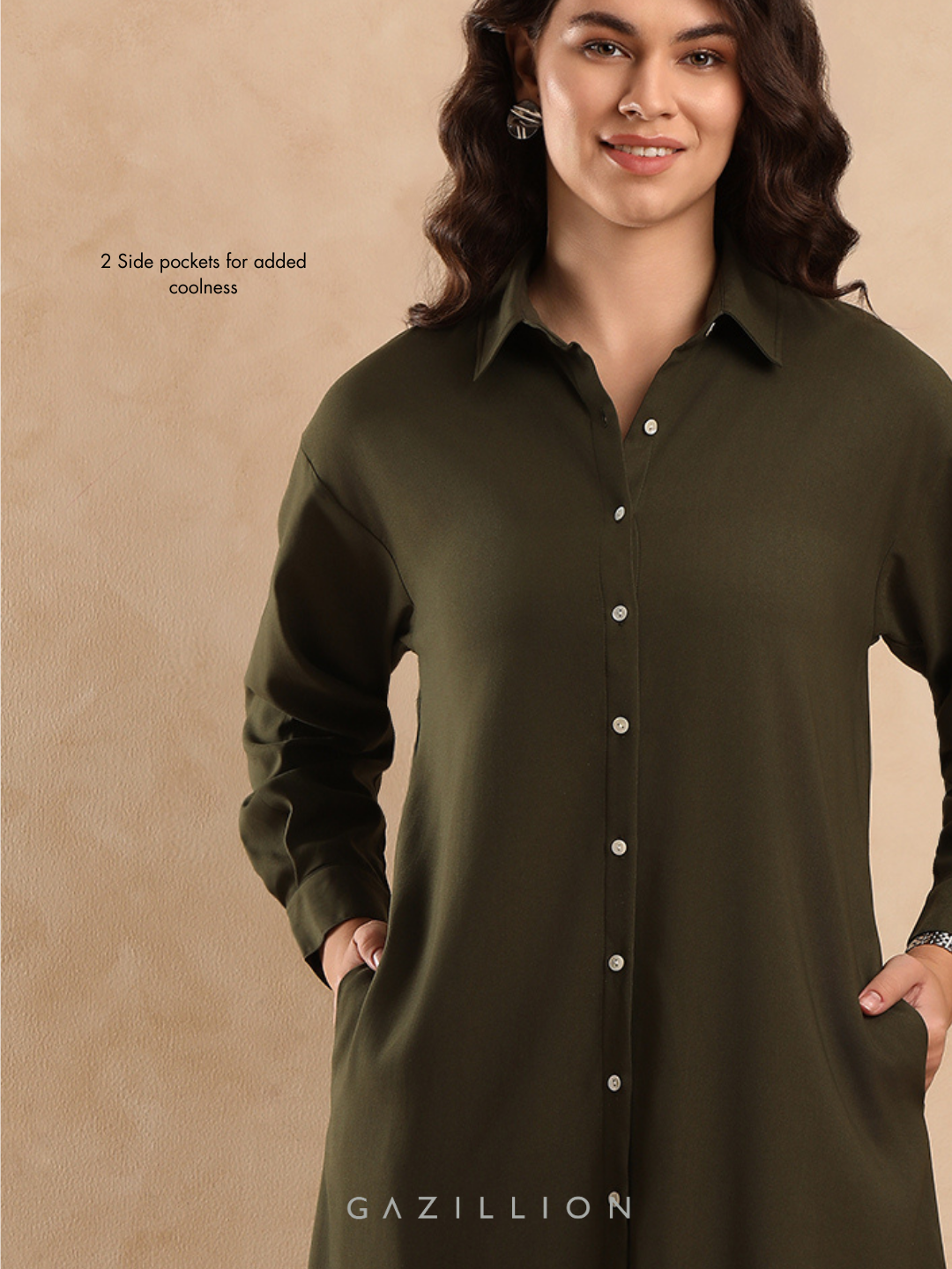 Woman wearing a green dress with side pockets on a beige background.