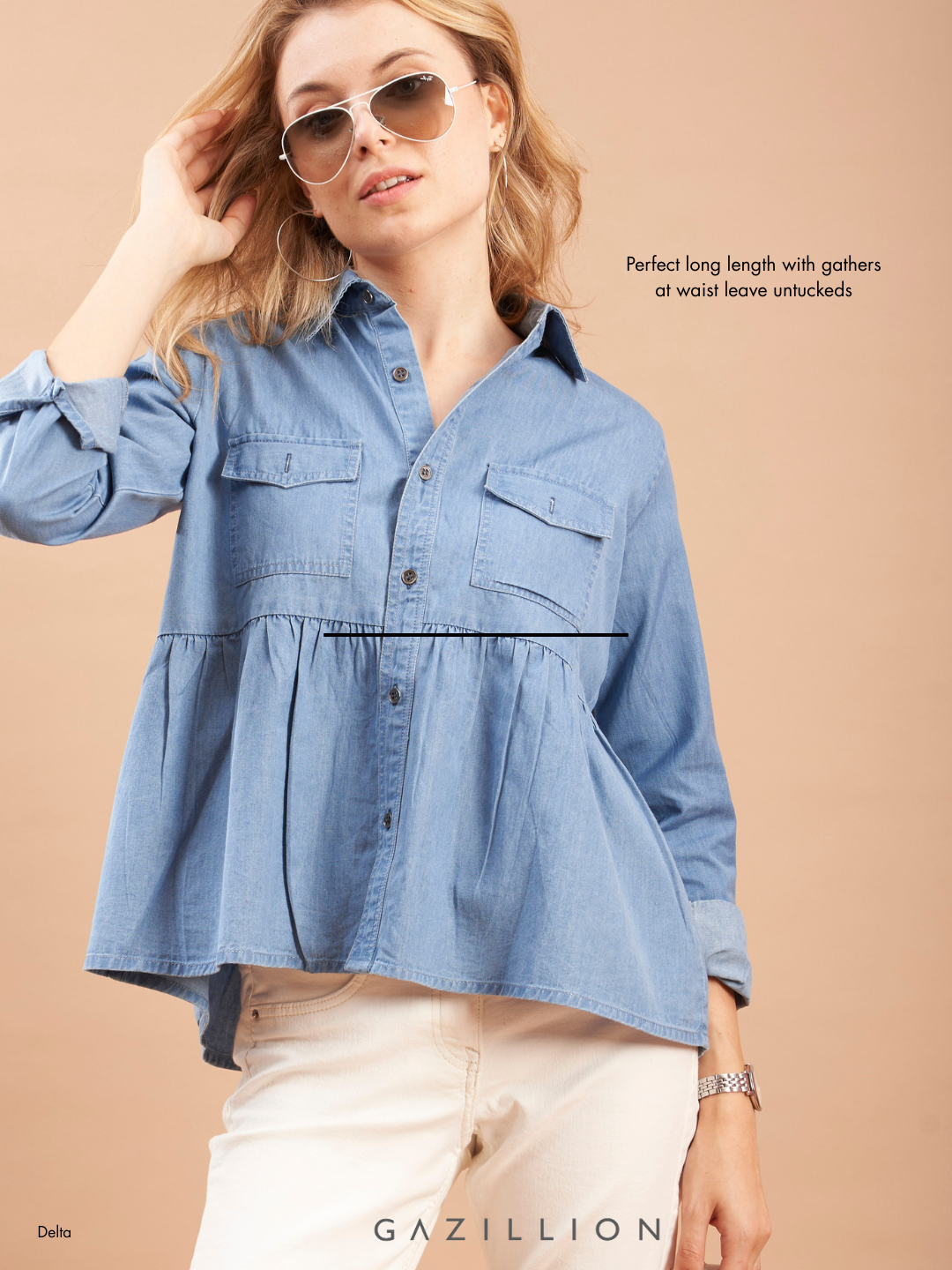 Woman wearing a blue denim shirt on a beige background