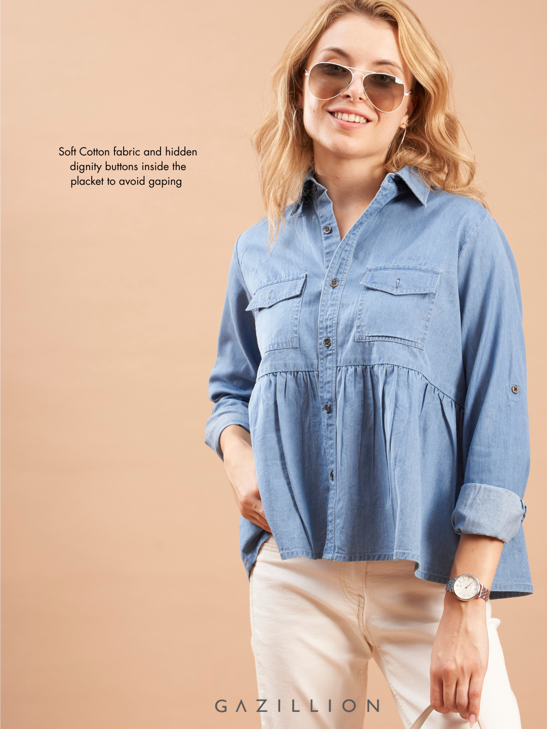 Woman wearing a blue denim shirt with soft cotton fabric and design on a beige background
