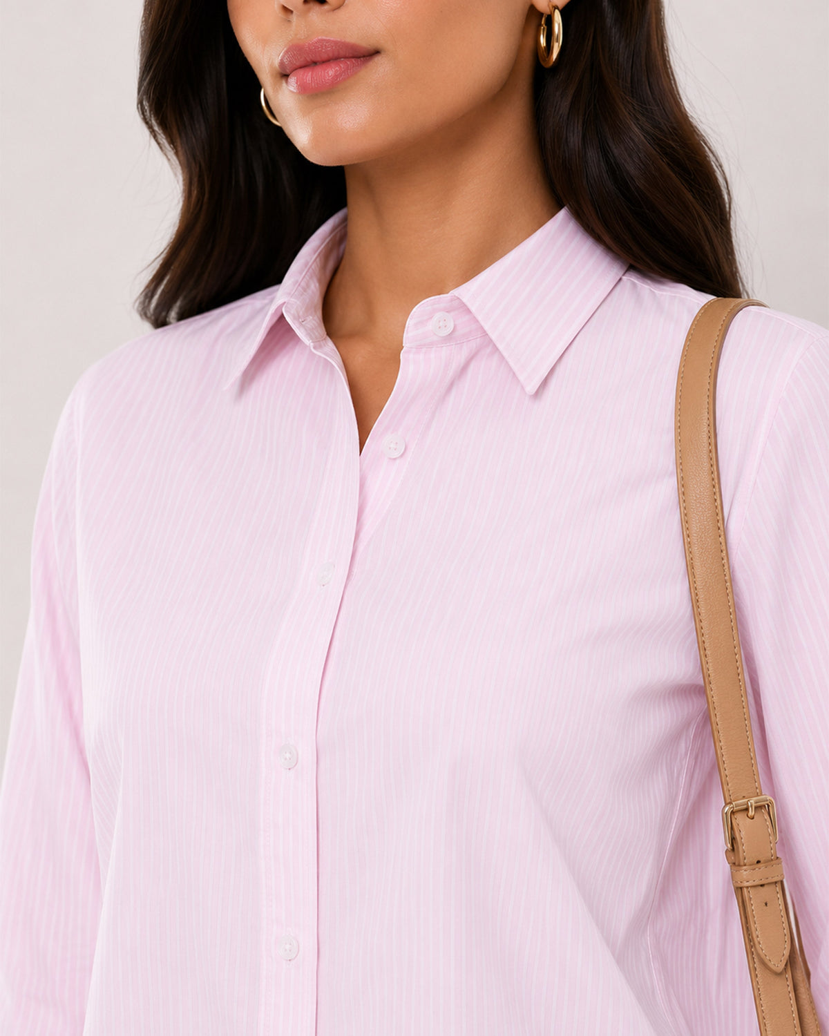 Aksa pink and white striped shirt collar close-up with the hidden dignity buttons