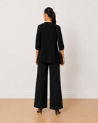 Alda black 100% viscose plus size top back view with the boxy fit and curved hem