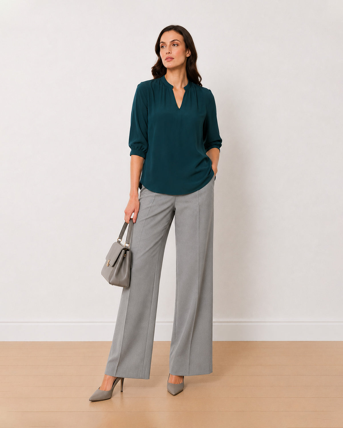 Alda bottle green viscose plus size top, angled view with the extended shoulders