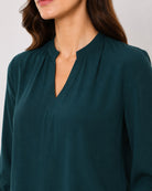 Alda bottle green viscose top stand collar with V-neck close-up, smart and classy