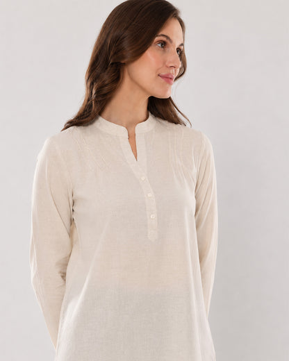 Alexa beige cotton linen tunic shirt, angled waist up view of the relaxed tunic fit