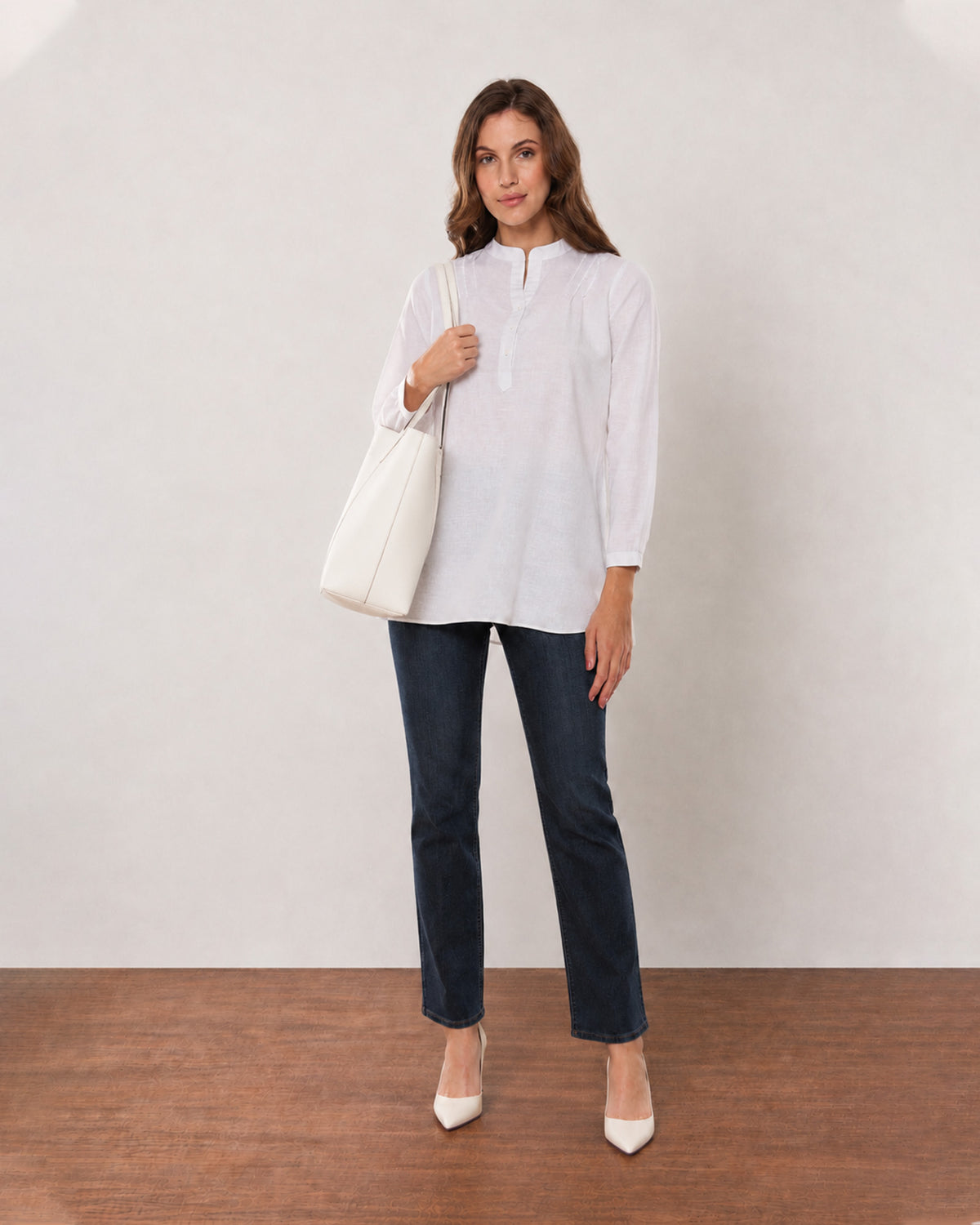 Alexa white cotton linen tunic shirt, angled front view with the long tunic length