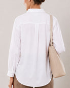 Alexis white cotton linen shirt back yoke close-up with the drop shoulder seam