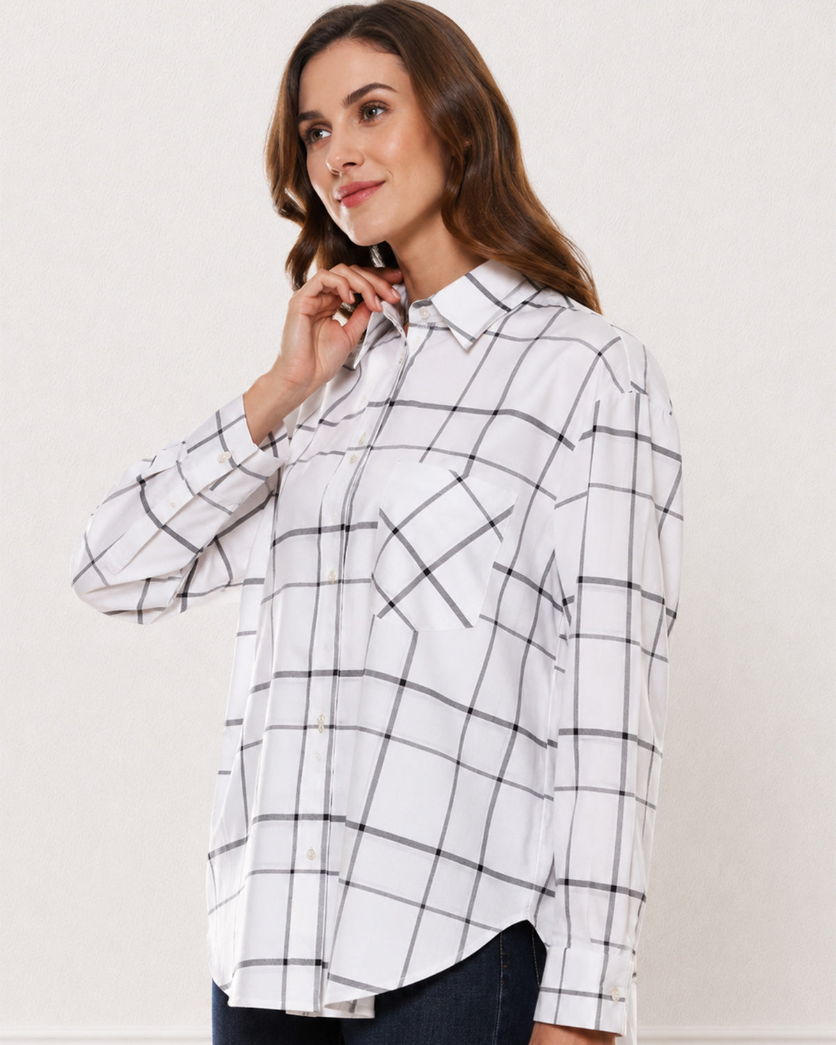 Alivia white checks cotton shirt waist up angled with the large yarn dyed checks