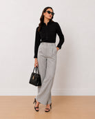 Allaya black denim utility shirt, angled front view with the 2 utility pockets