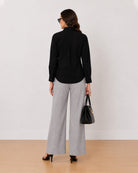 Allaya black denim utility shirt back view with the long length and curved hem