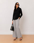 Allaya black denim utility shirt on the move, front view with full sleeves