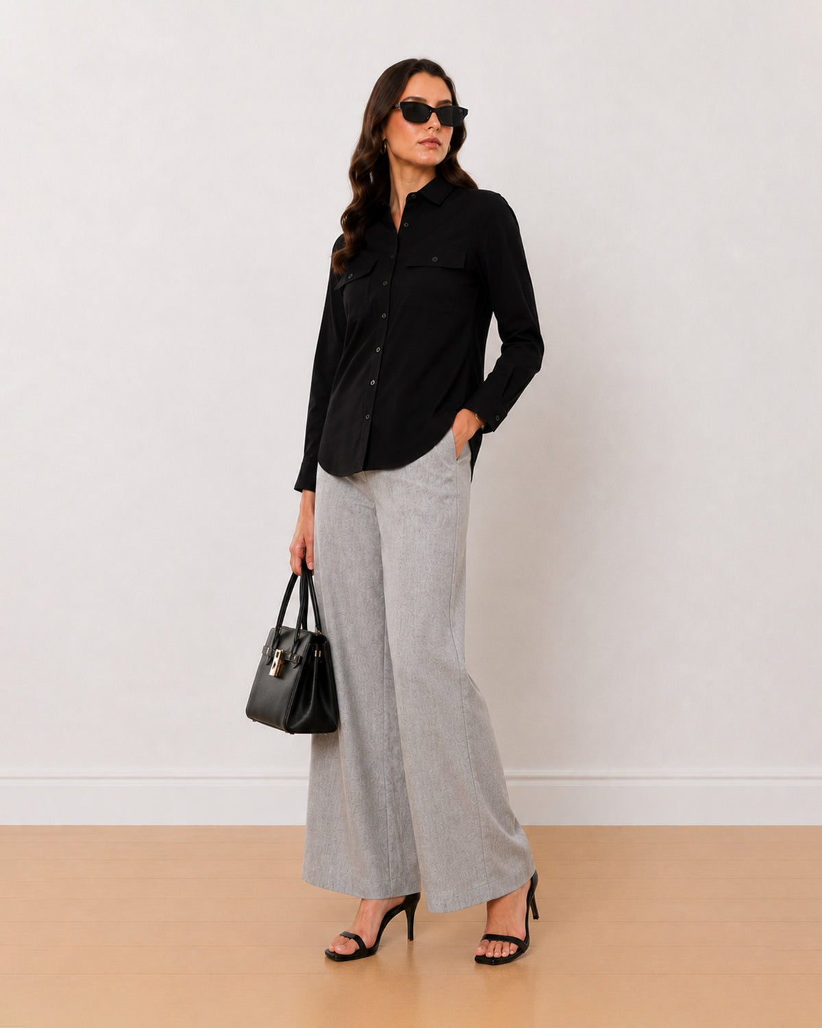 Allaya black denim utility shirt on the move, front view with full sleeves