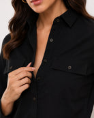 Allaya black denim shirt placket, utility pocket and the hidden dignity buttons
