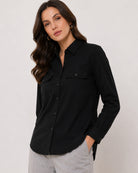 Allaya black denim shirt waist up front with the 2 flap utility pockets