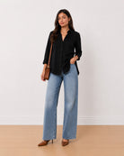 Allison black denim longline shirt, angled front view with the slim tall silhouette