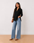 Allison black denim longline cotton shirt, angled view with the side slit