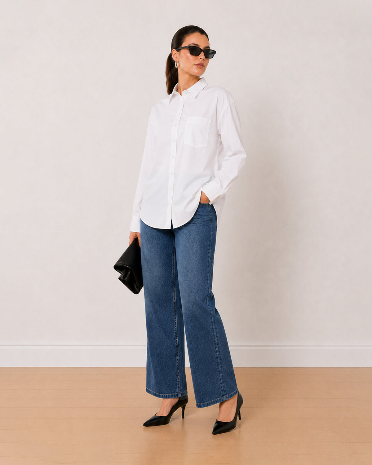 Alma white Giza cotton oversized shirt, angled view with the luxurious shine