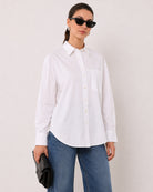 Alma white Giza cotton shirt waist up front with the patch pocket and curved hem