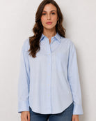 Alma sky blue Giza cotton oversized shirt waist up front with the curved hem