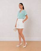 Alva green and white striped 100% viscose top, angled front view with the boxy fit