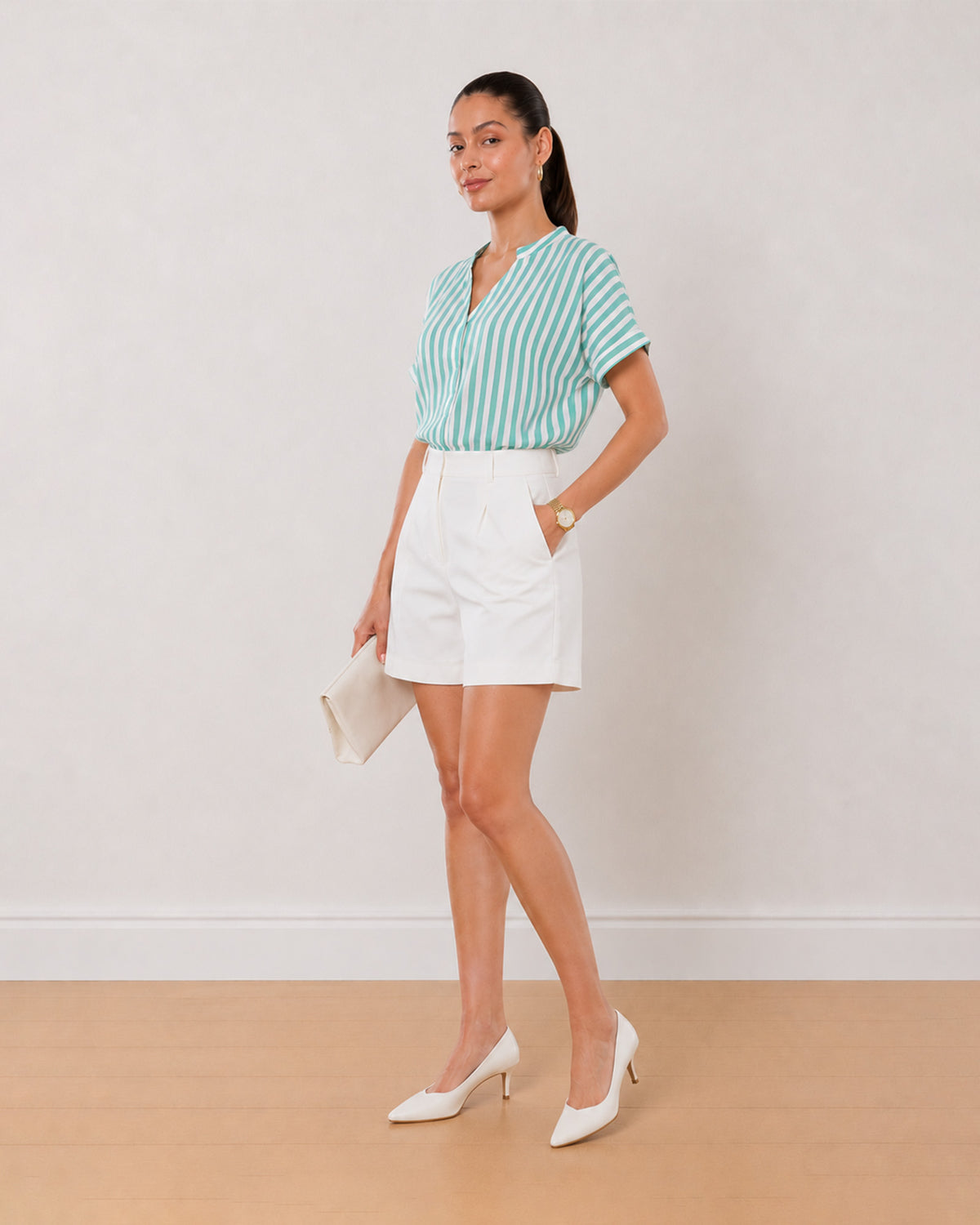 Alva green and white striped 100% viscose top, angled front view with the boxy fit