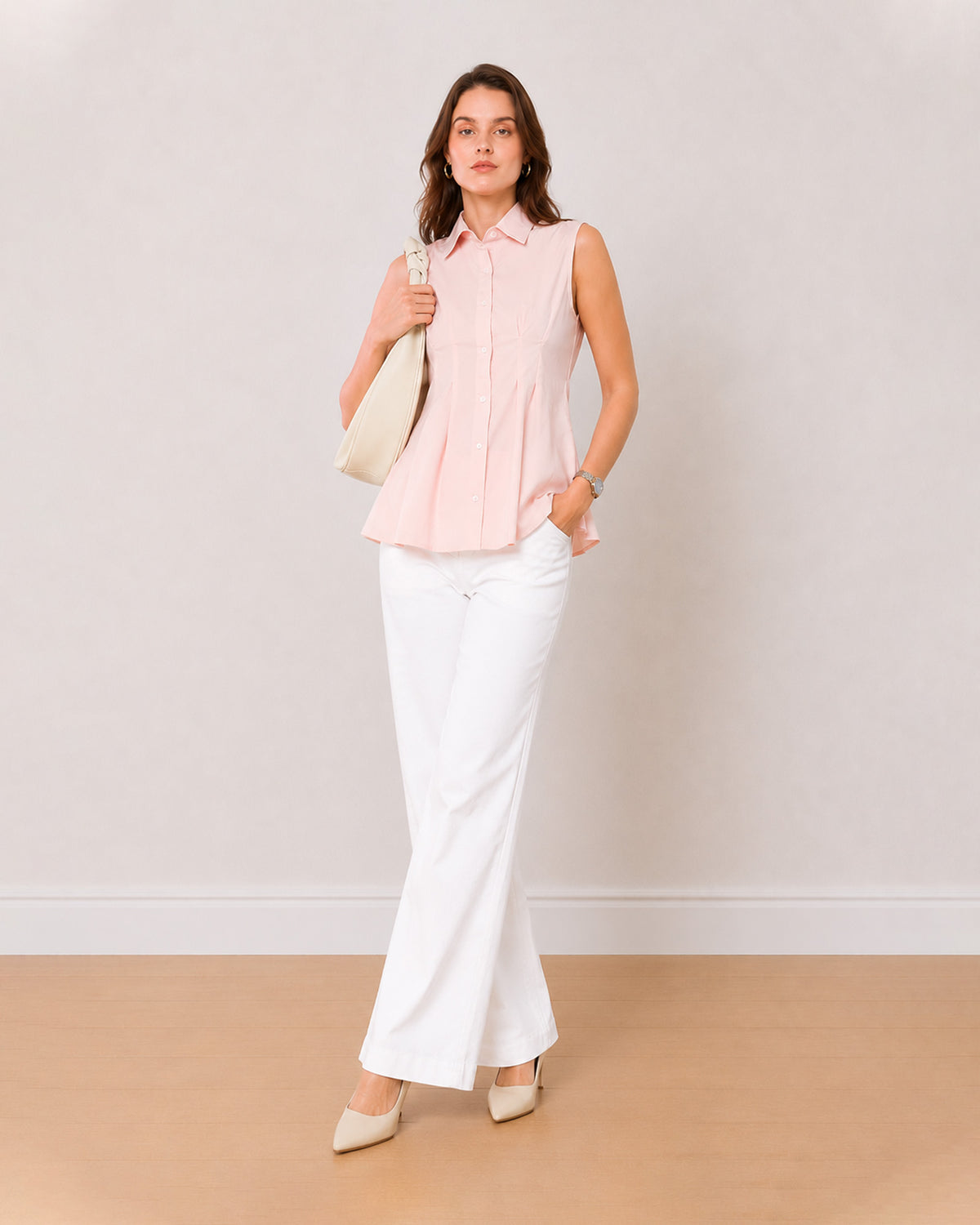 Amelia baby pink sleeveless cotton shirt on the move, tailored front view