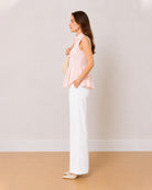 Amelia baby pink sleeveless cotton poplin shirt side profile with the flared hem