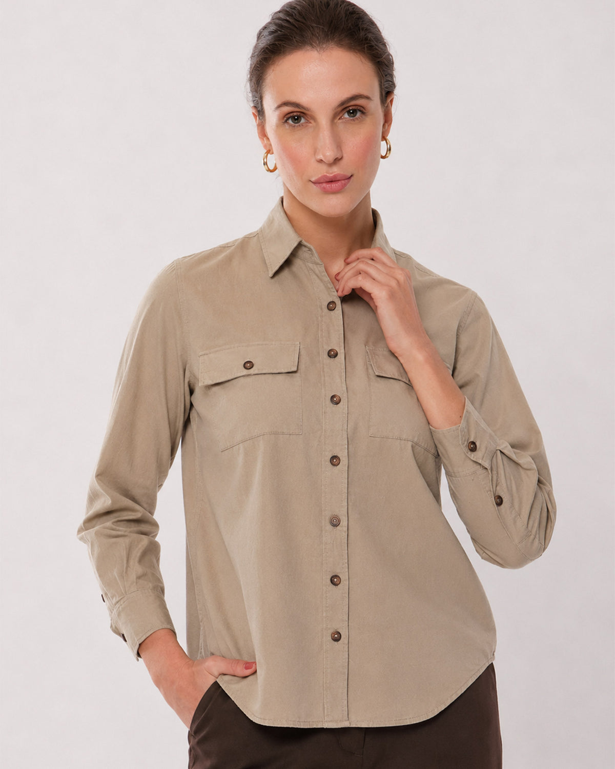 Analia fawn beige corduroy shirt waist up front with the 2 flap utility pockets