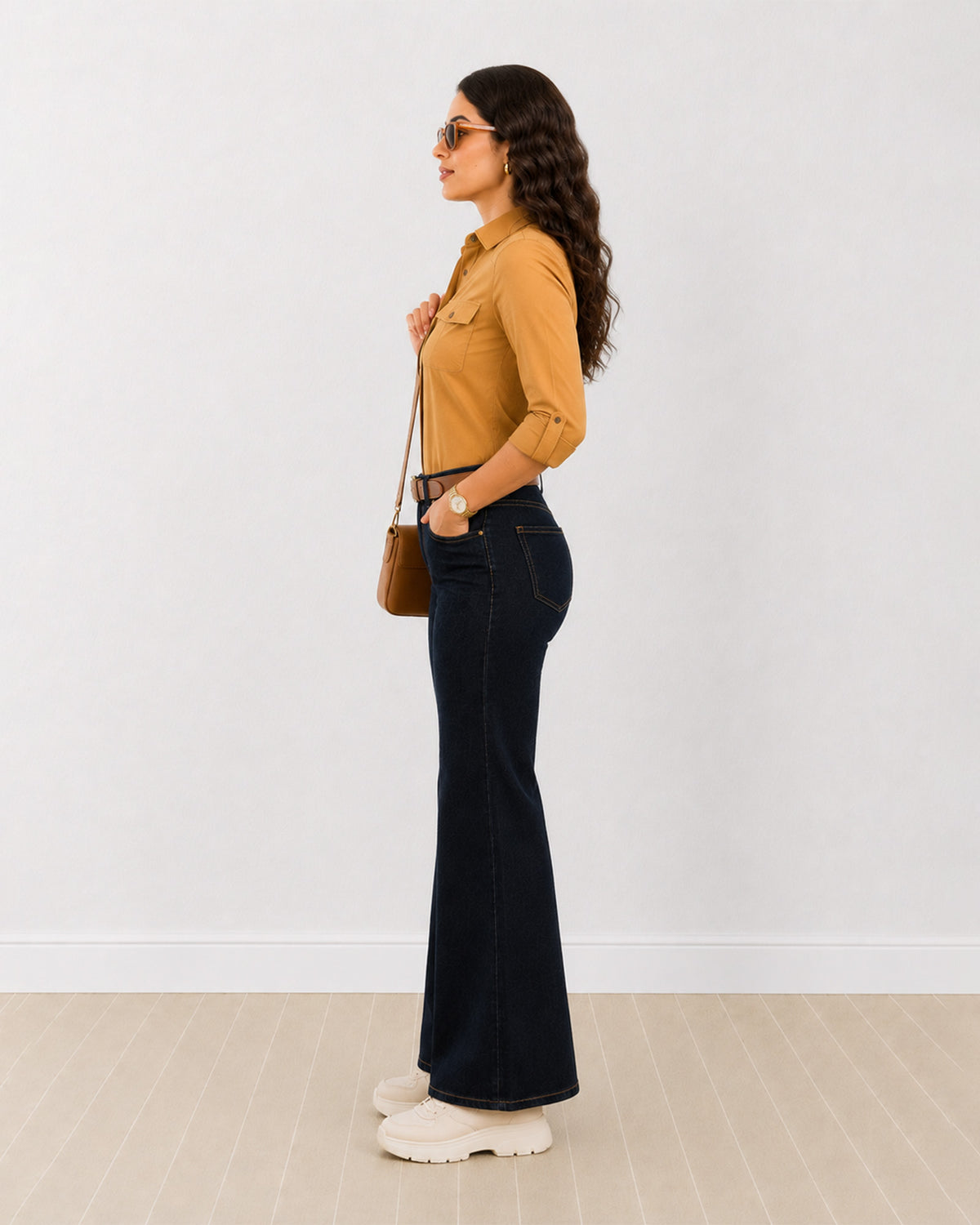 Analia mustard yellow corduroy utility shirt side profile with the curved hem