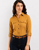 Analia mustard yellow corduroy shirt waist up front with the 2 flap utility pockets