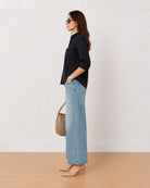 Analia navy blue corduroy utility shirt side profile with the curved hem