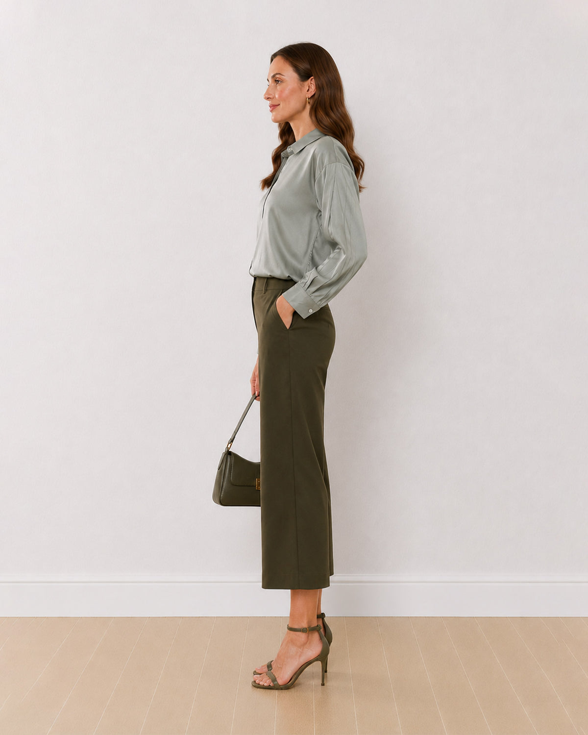 Angel sage green viscose formal shirt side profile with the curved hem