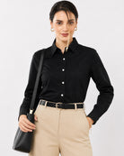 Anna black cotton poplin shirt waist up front with the contrast white buttons