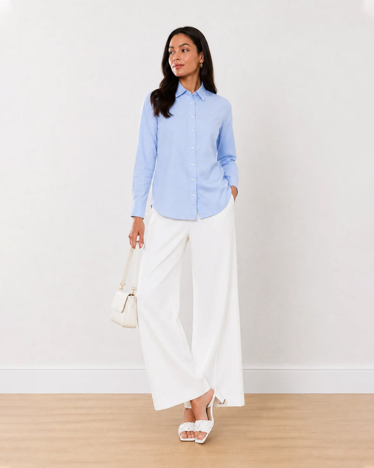 Aria sky blue Oxford cotton shirt on the move, front view with full sleeves