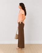 Ariana peach slubbed cotton formal shirt side profile with the curved hem