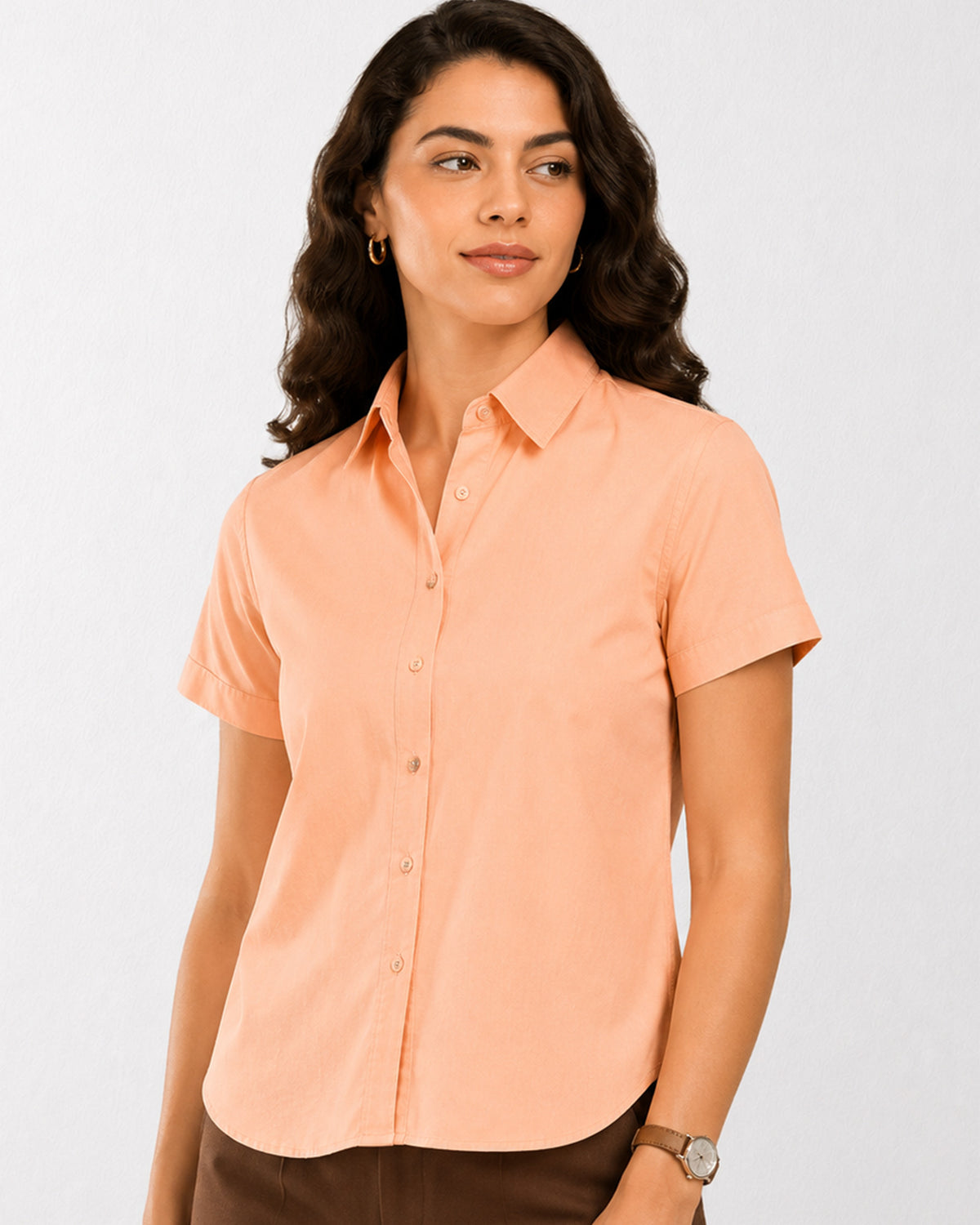 Ariana peach cotton shirt waist up front with the half sleeves and curved hem