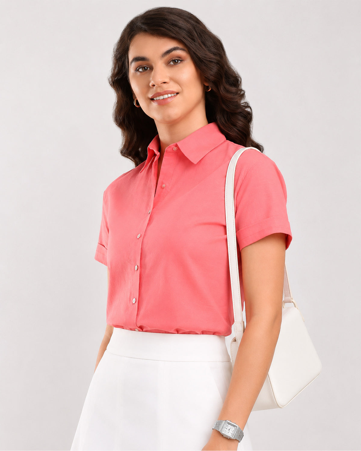 Ariana pink cotton shirt waist up front, half sleeves and hidden dignity buttons