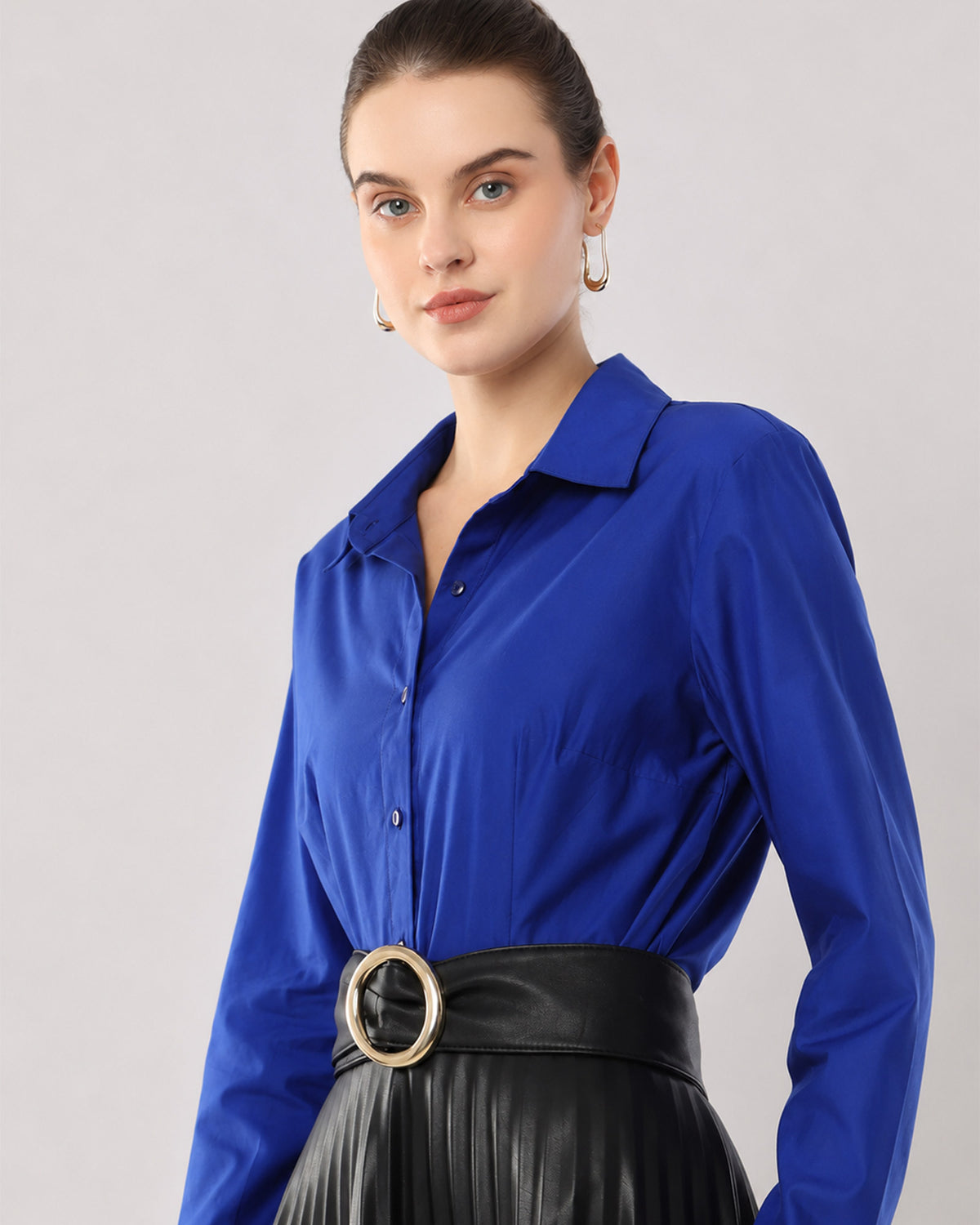 Armani royal blue cotton shirt waist up angled with the satin shine
